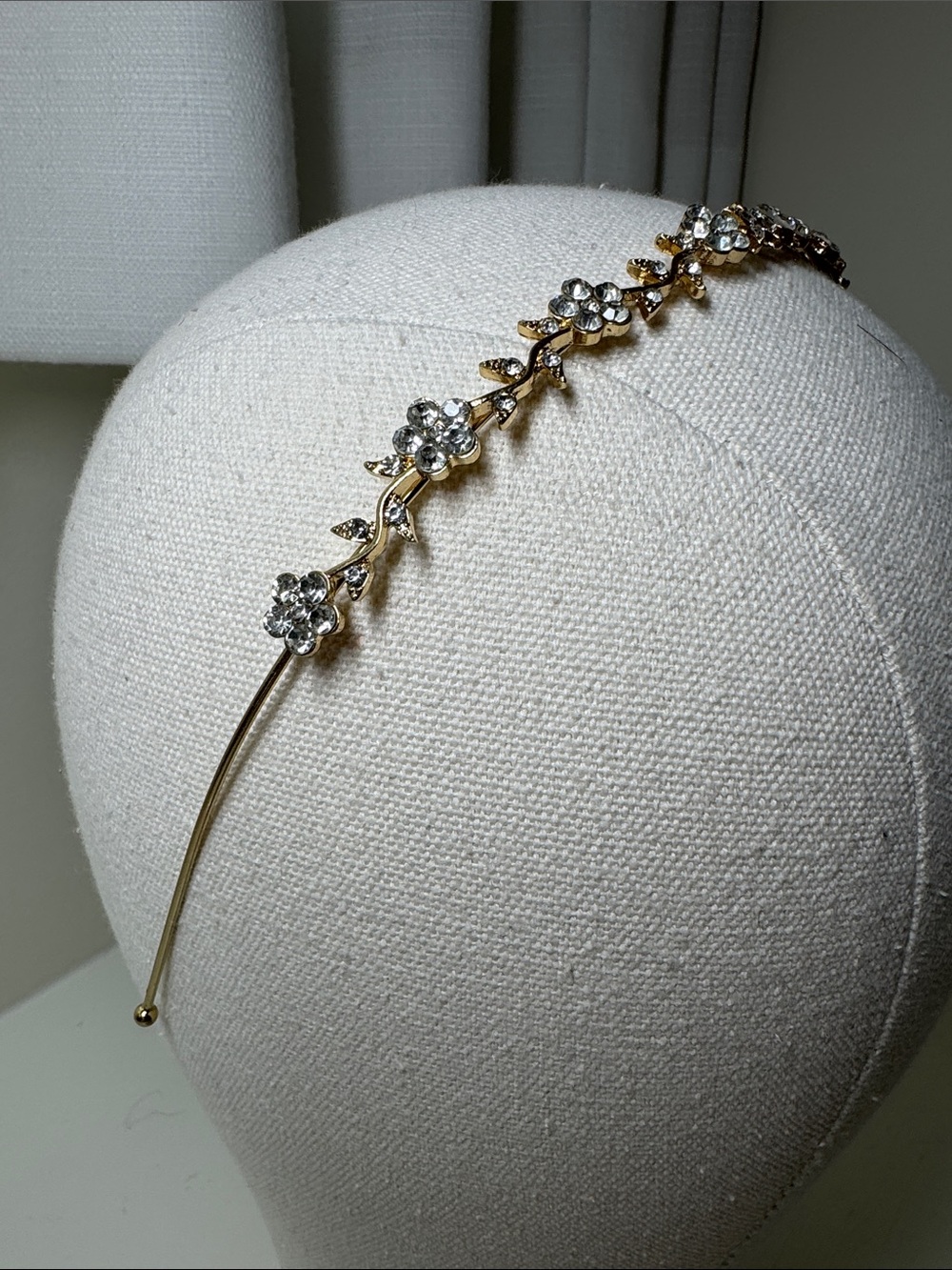 Floral design rhinestone and gold headband.